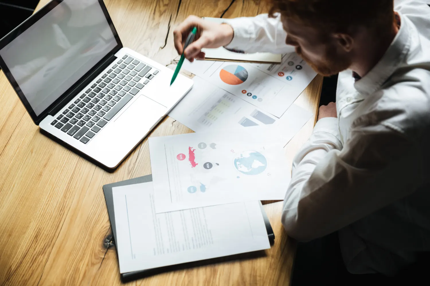 SEO analyst reviewing audit process workflow with data reports and analytics charts